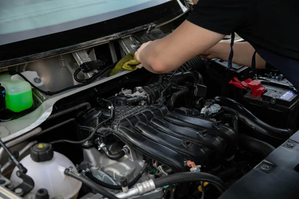 When installing a car battery: which terminal first?